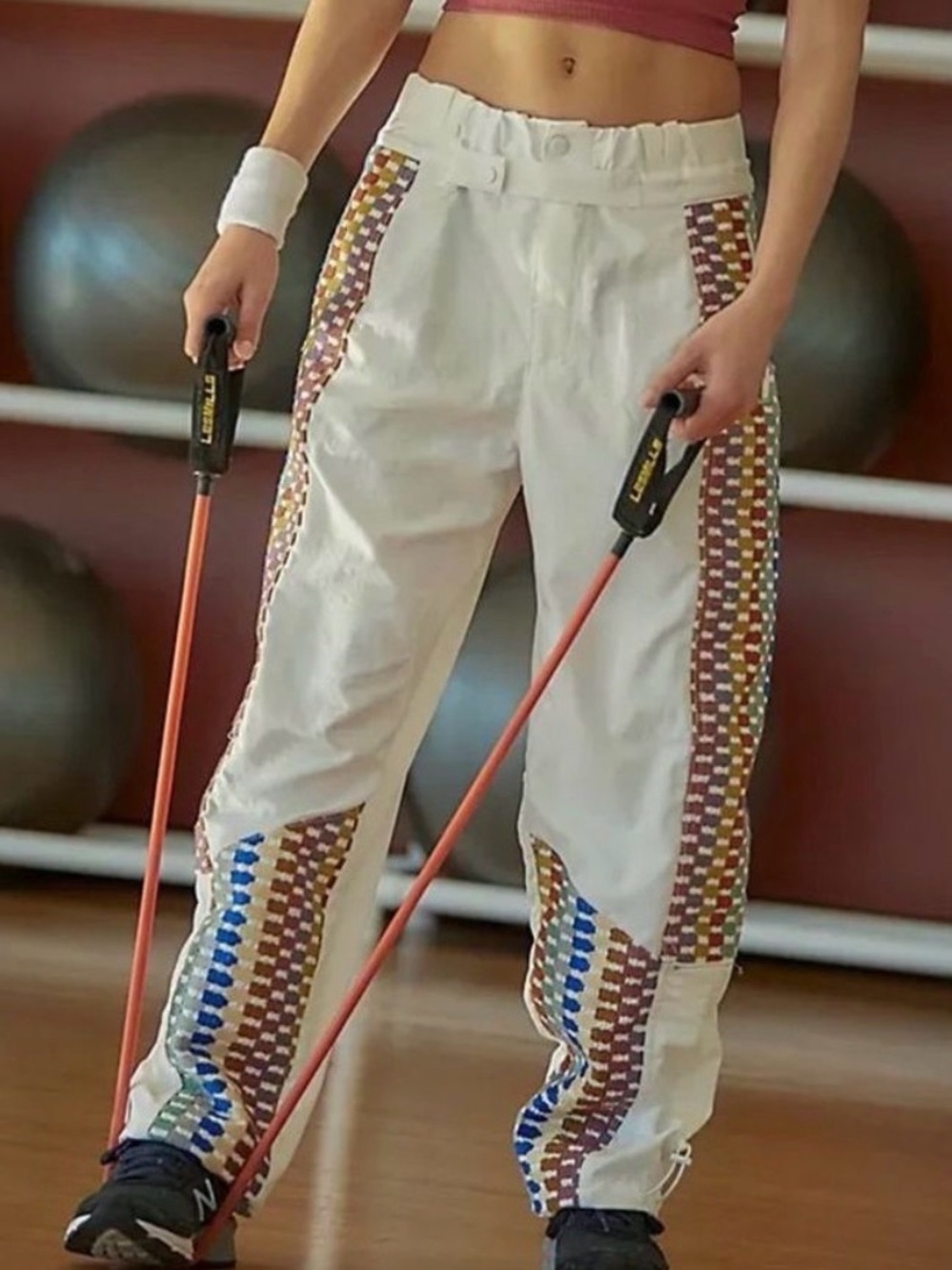 Free People Movement Kaleidoscope track pants with fully embroidered sides.